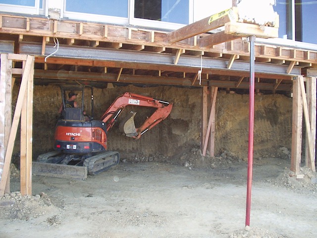 Excavation underneath house for underpinning and new basement