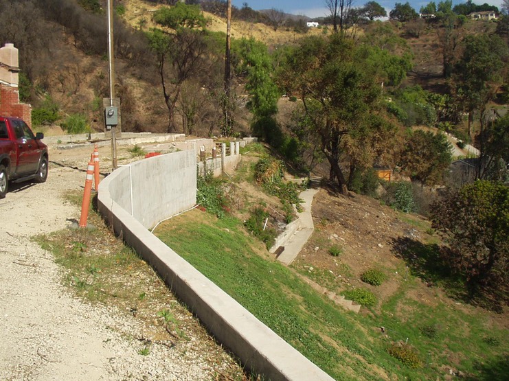 New Retaining Wall with Caissons and Tiebacks after Landslide